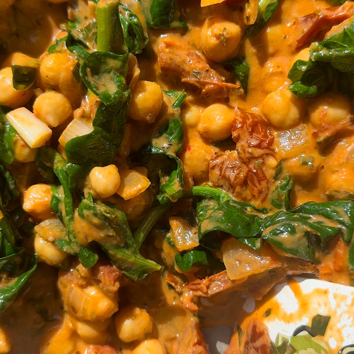 tuscan chickpeas in pan with spinach