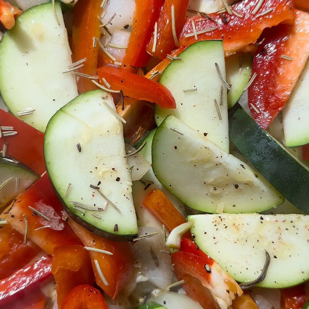 zucchini and peppers in pan