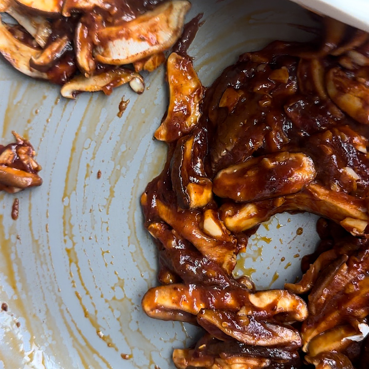 mushrooms in pan with sauce