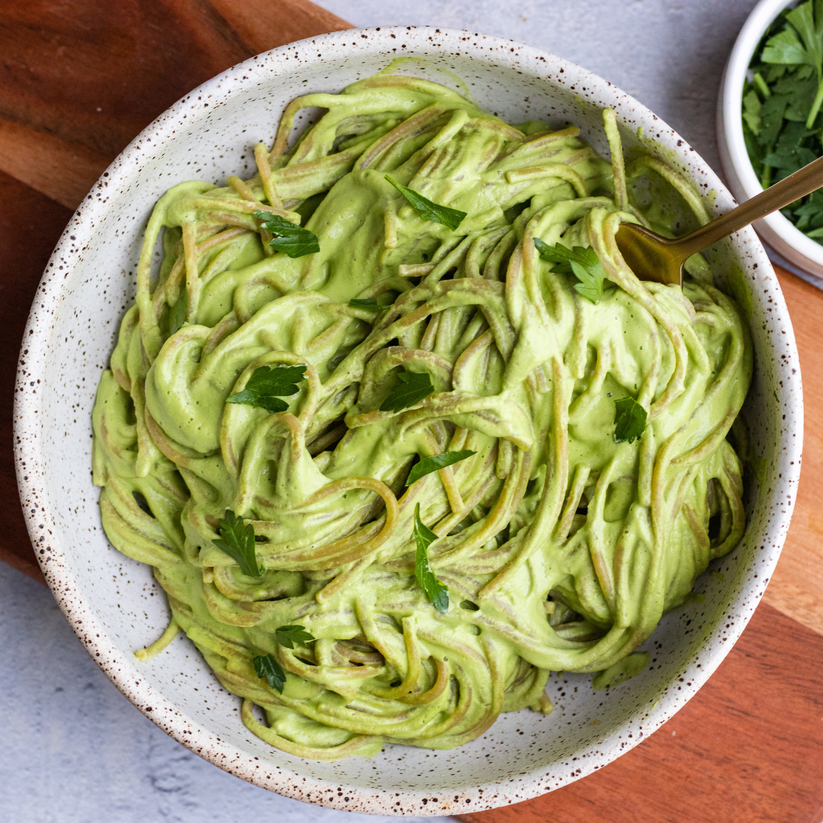 vegan spinach garlic pasta with parsley and cashews