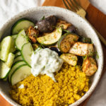 mediterranean tofu bowl with yellow quinoa