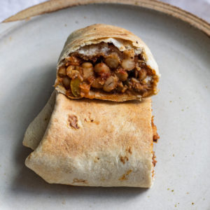 vegan pizza wrap with white beans and mushroom