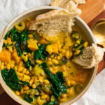 vegan golden harvest soup with squash white beans leeks and kale