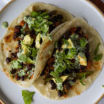 vegan fall black bean tacos with cilantro lime tahini sauce