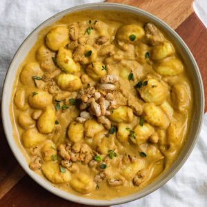 vegan creamy acorn squash pasta with crispy white beans