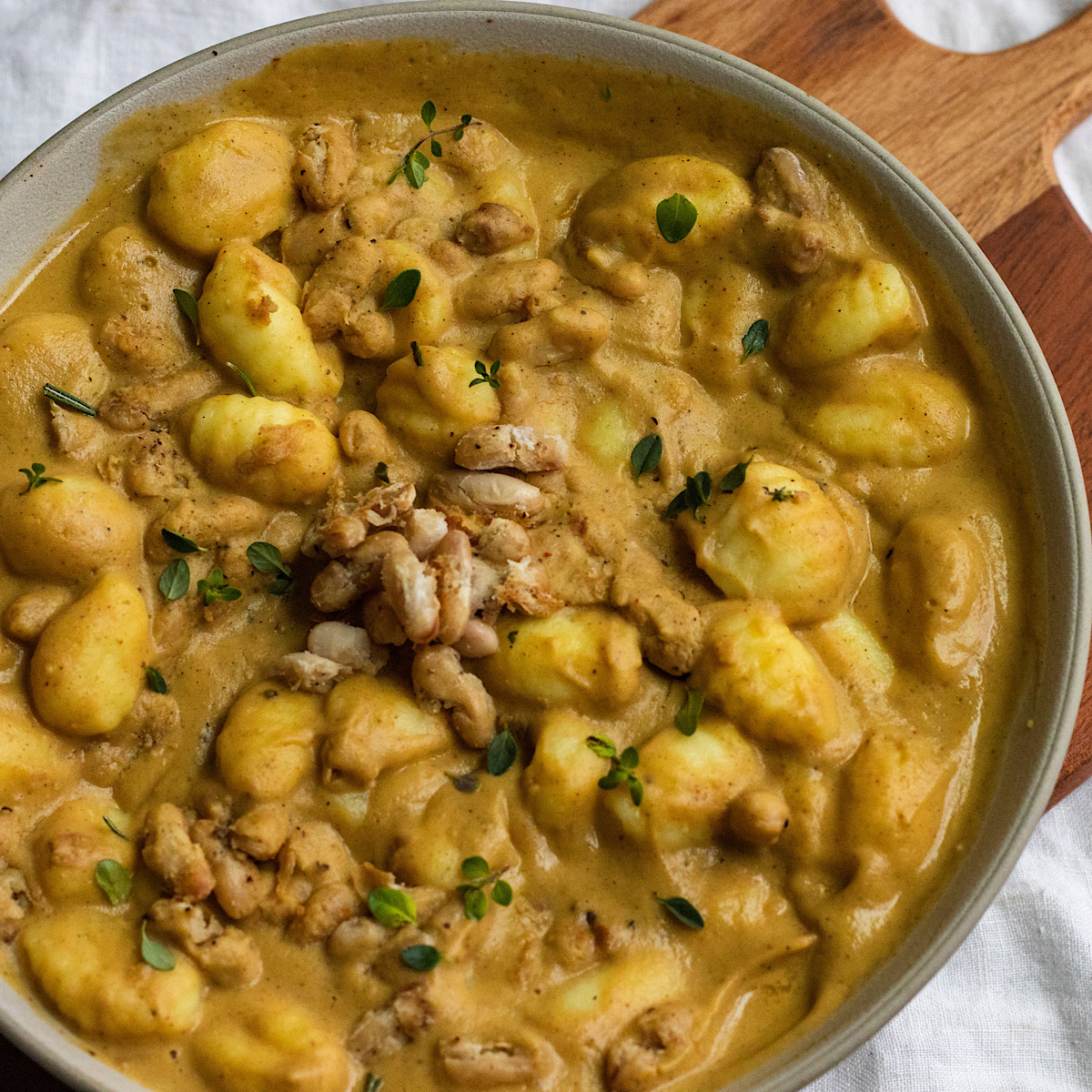 vegan creamy acorn squash gnocchi with crispy white beans