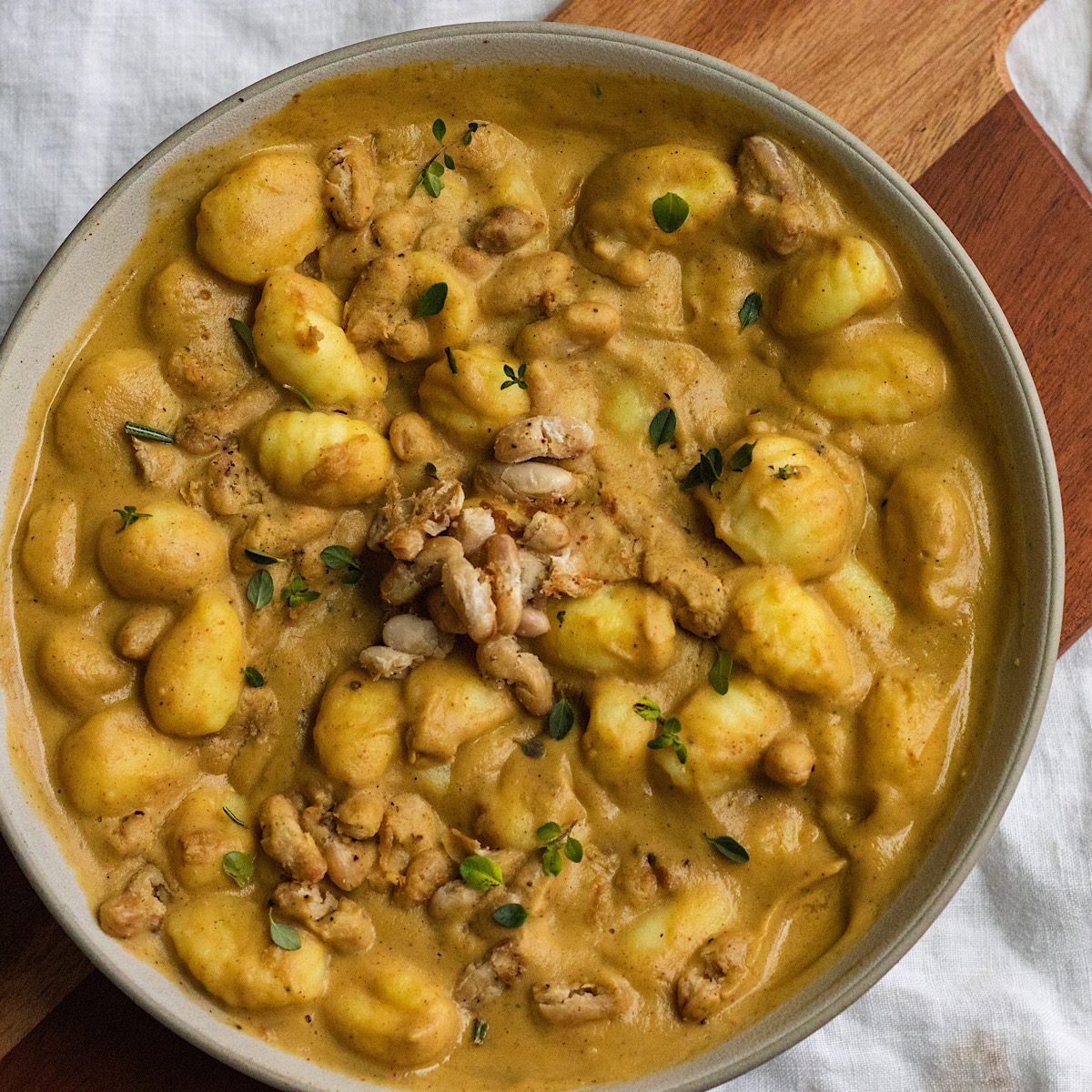 vegan creamy acorn squash gnocchi with crispy white beans