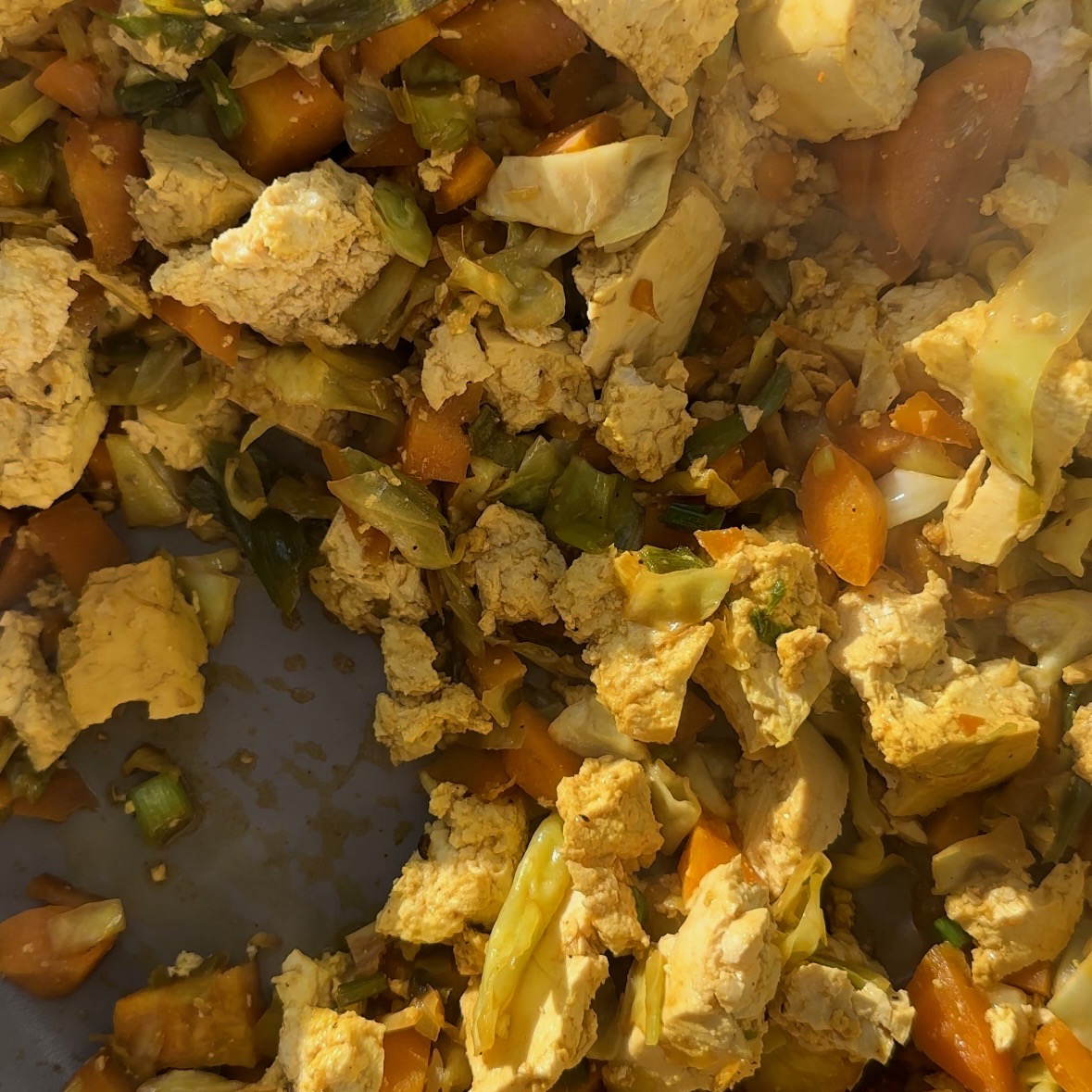 veggies and tofu in a pan