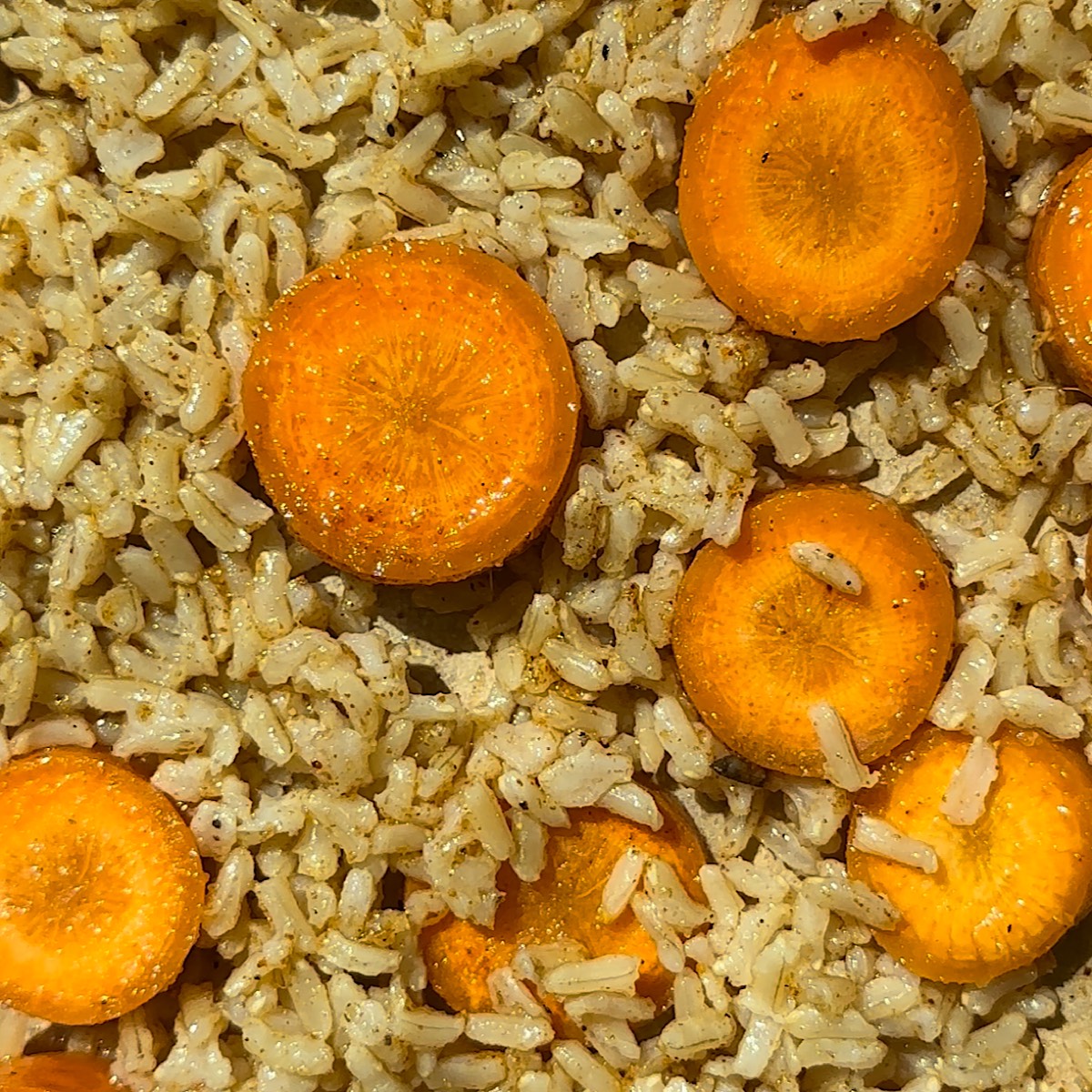 carrots and rice on a sheet pan