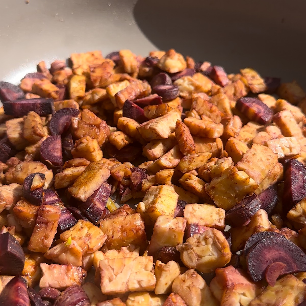 tempeh and carrots in skillet