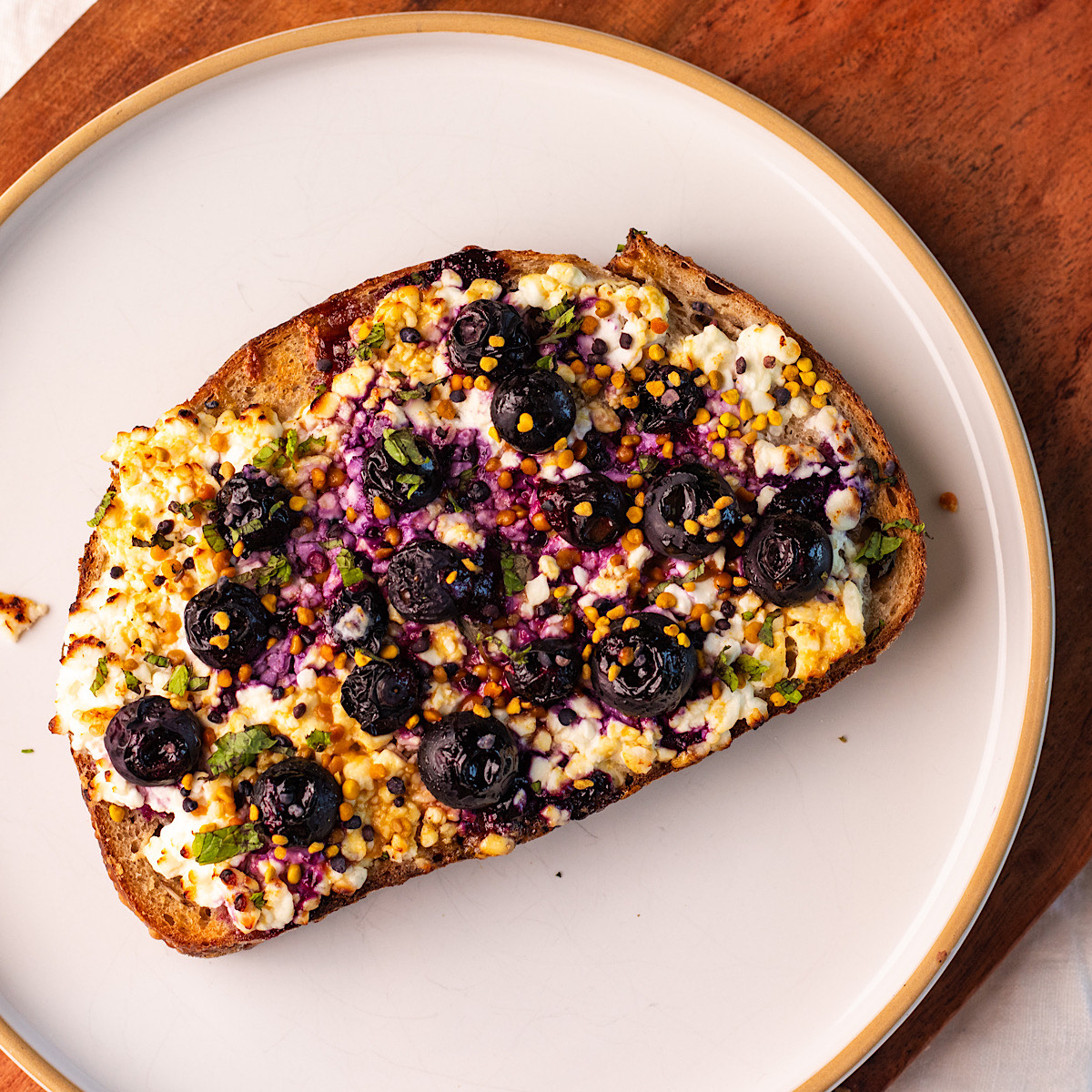 air fryer cottage cheese toast with blueberries and honey.