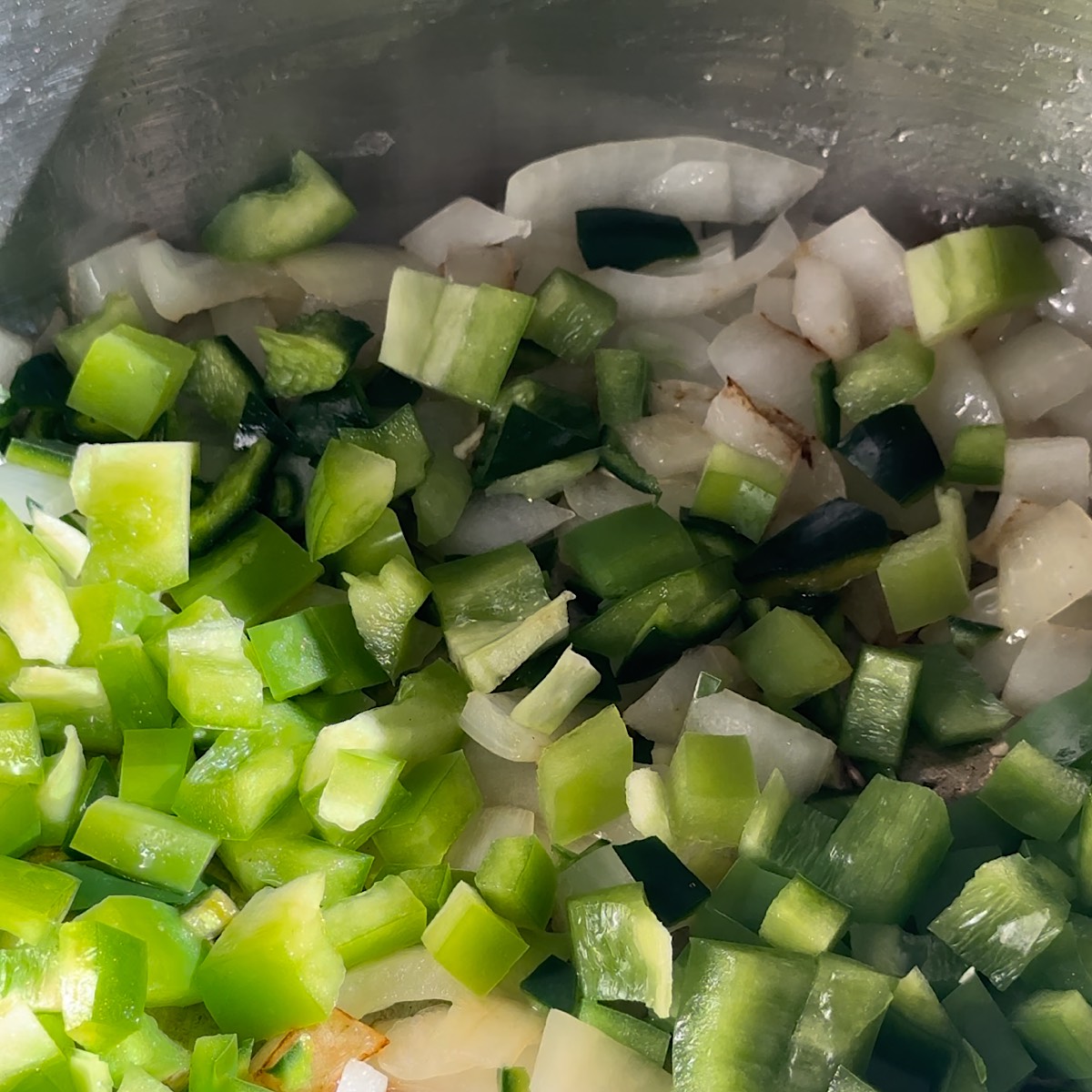 peppers onions and garlic in pot