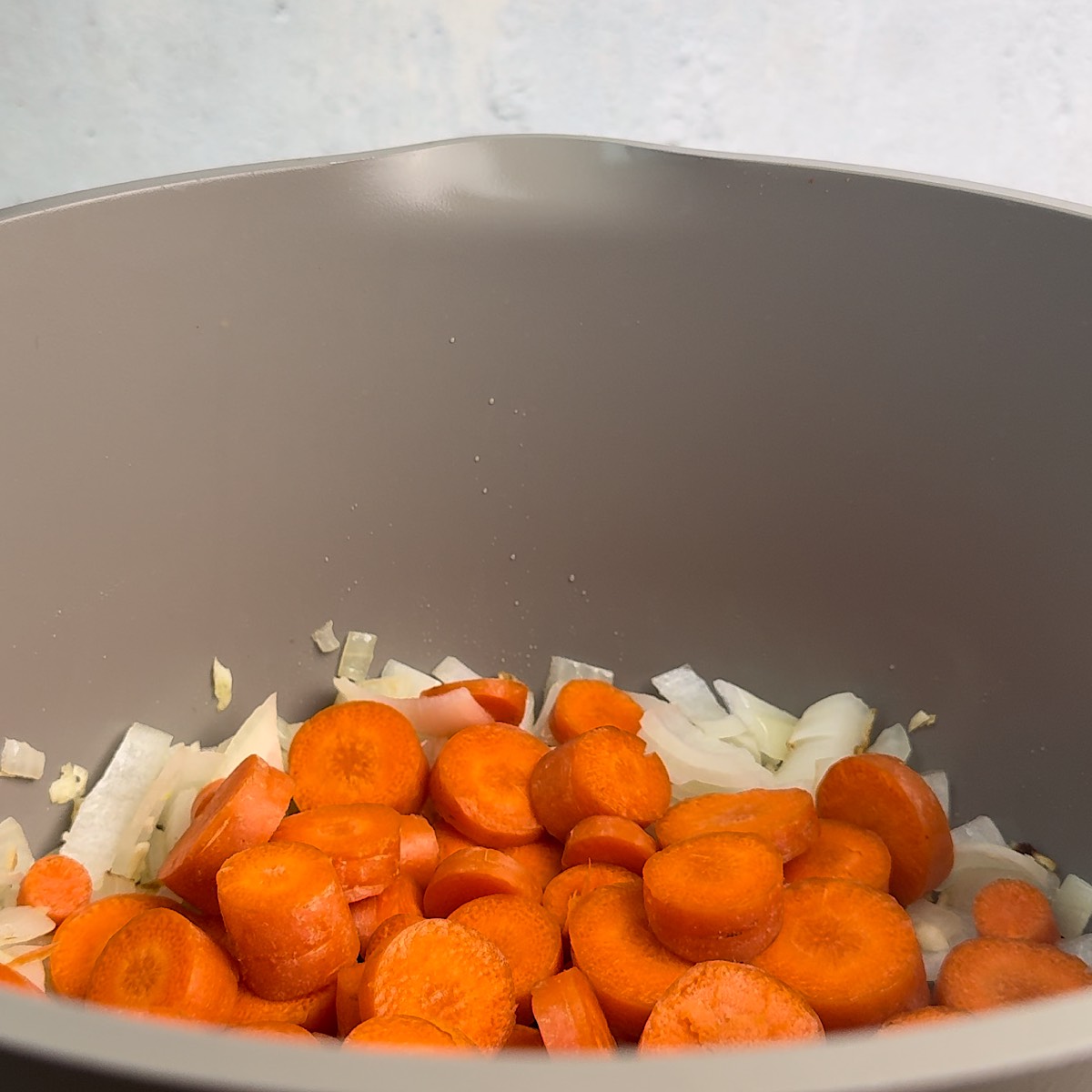 carrots onions and garlic in pot