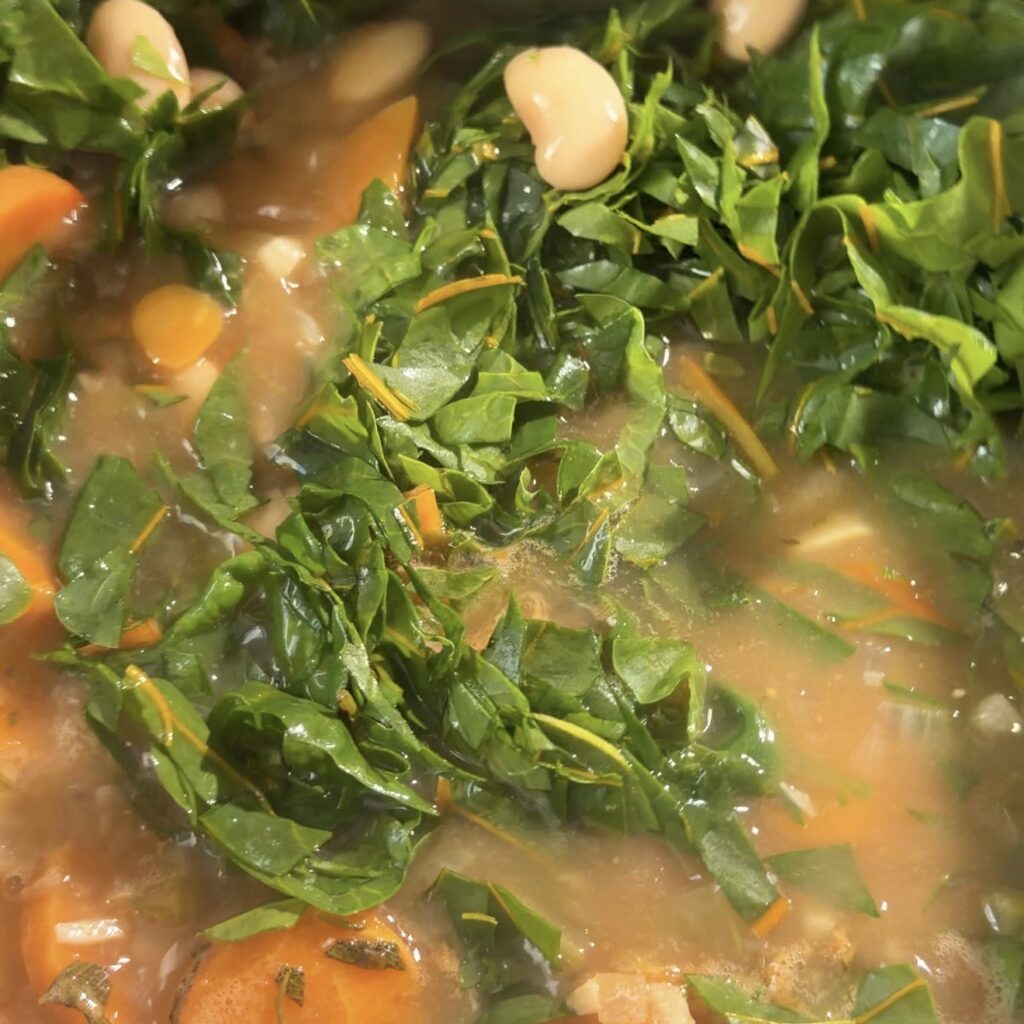 soup with greens in pot