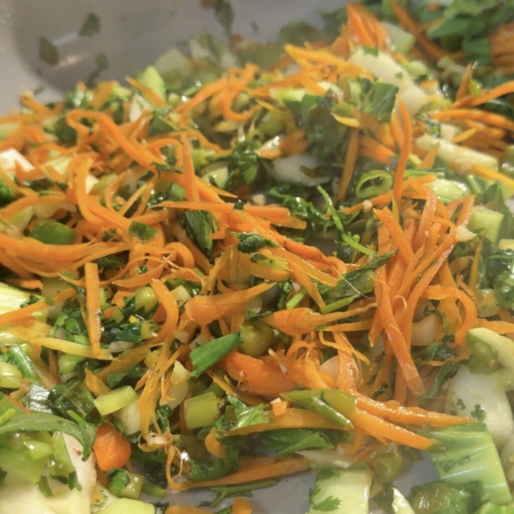 veggies cooking in skillet