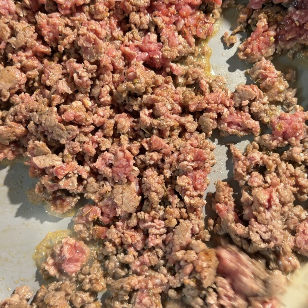 ground beef cooking in pan