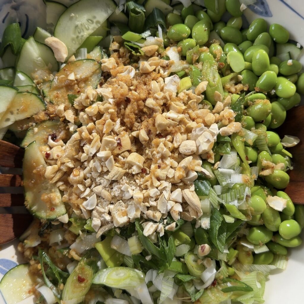 salad being tossed in bowl
