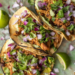 chipotle honey slow cooker chicken tacos with avocado crema