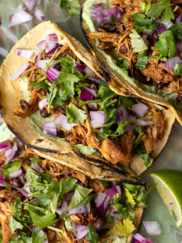chipotle honey slow cooker chicken tacos with avocado crema
