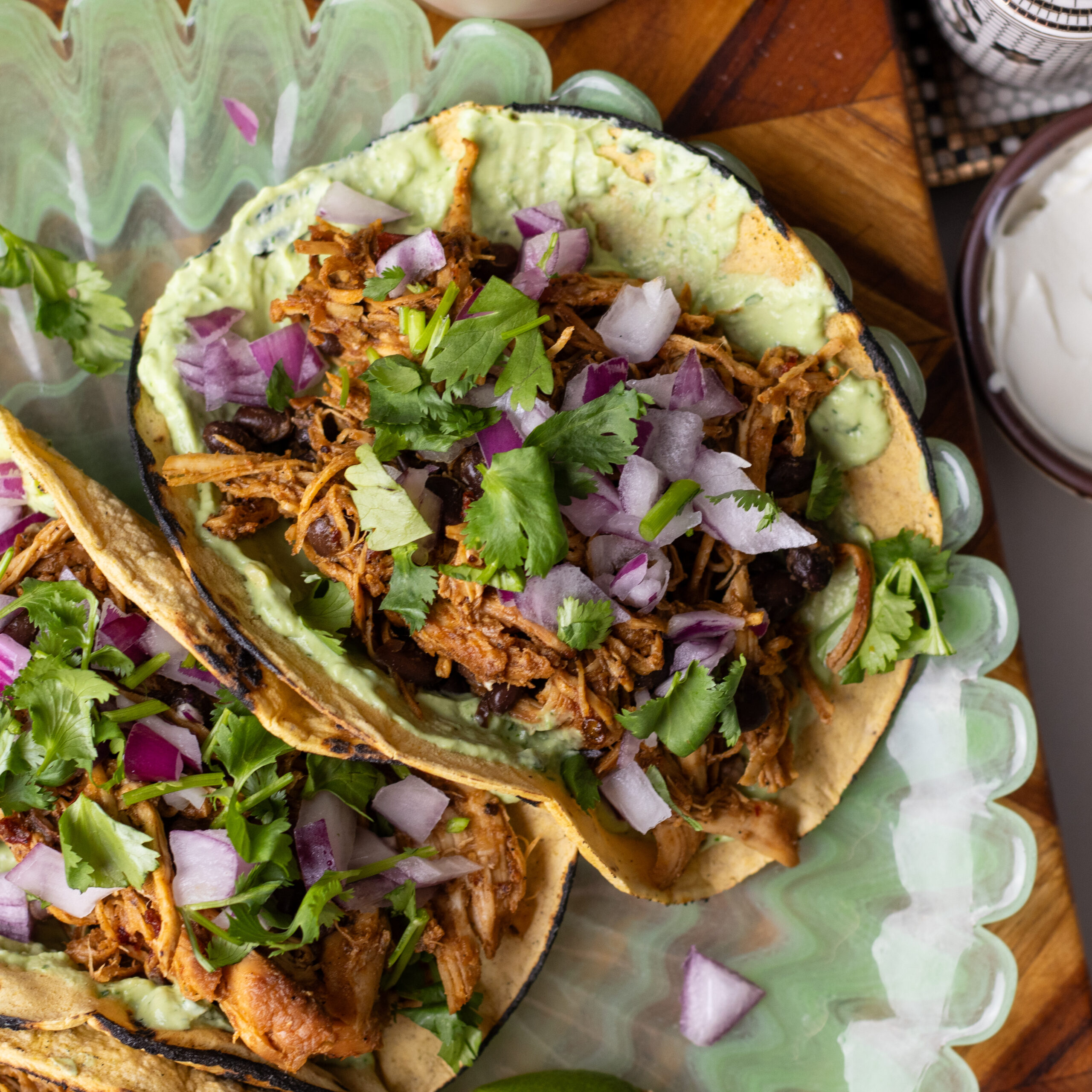 Slow Cooker Chipotle Honey Chicken Tacos with Avocado Crema 