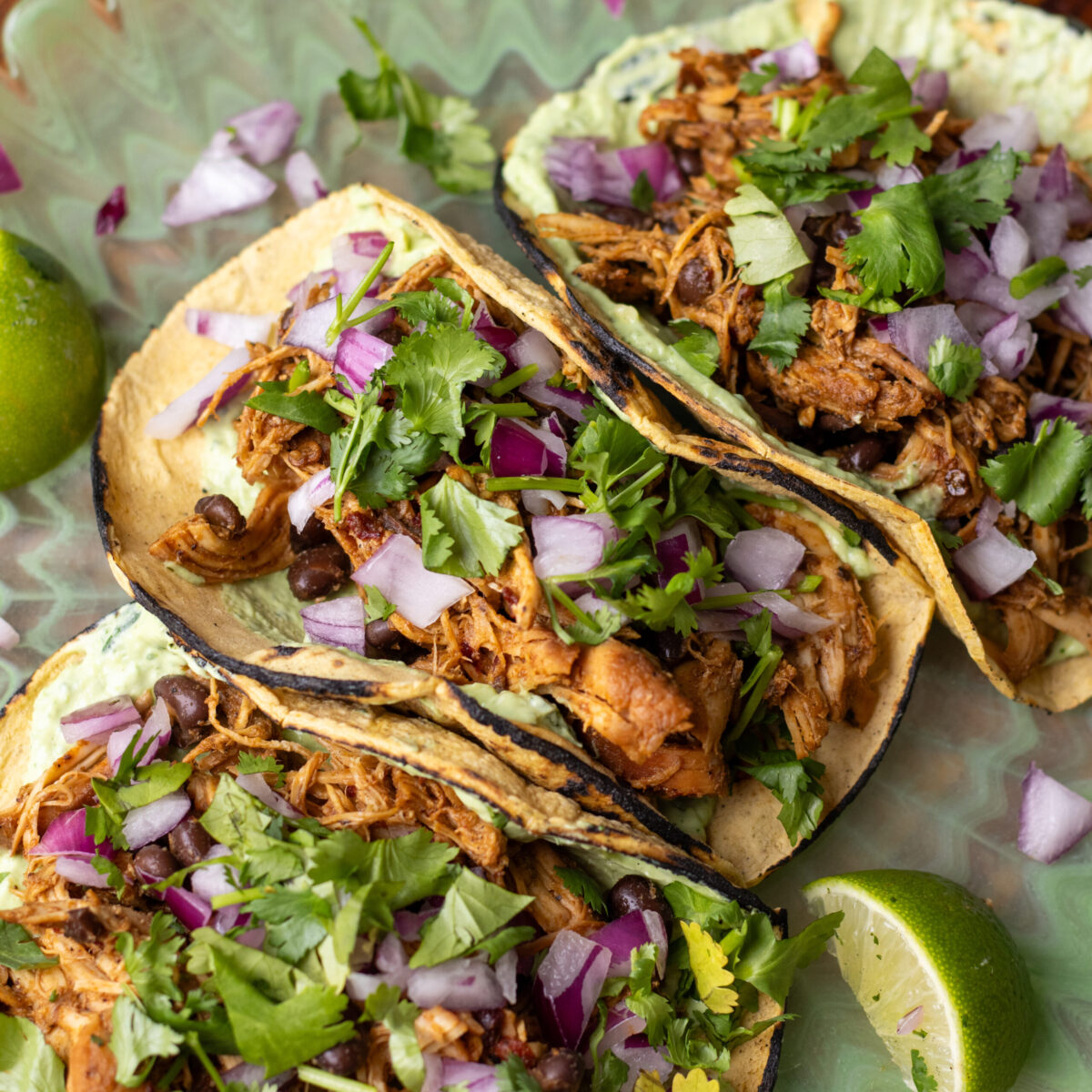 Slow Cooker Chipotle Honey Chicken Tacos with Avocado Crema 